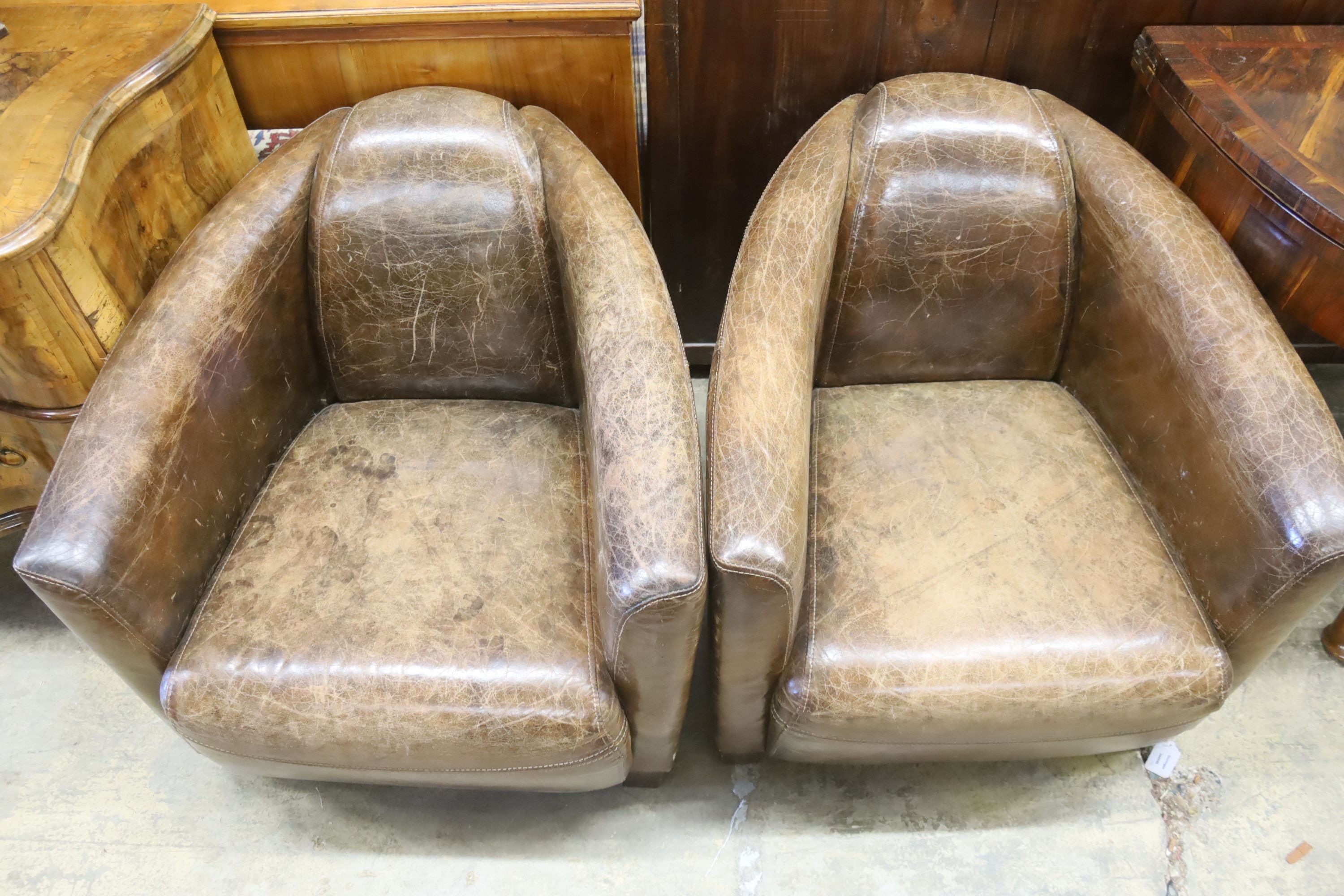 A pair of contemporary brown leather club chairs, in the Art Deco style, width 72cm, depth 80cm, height 65cm